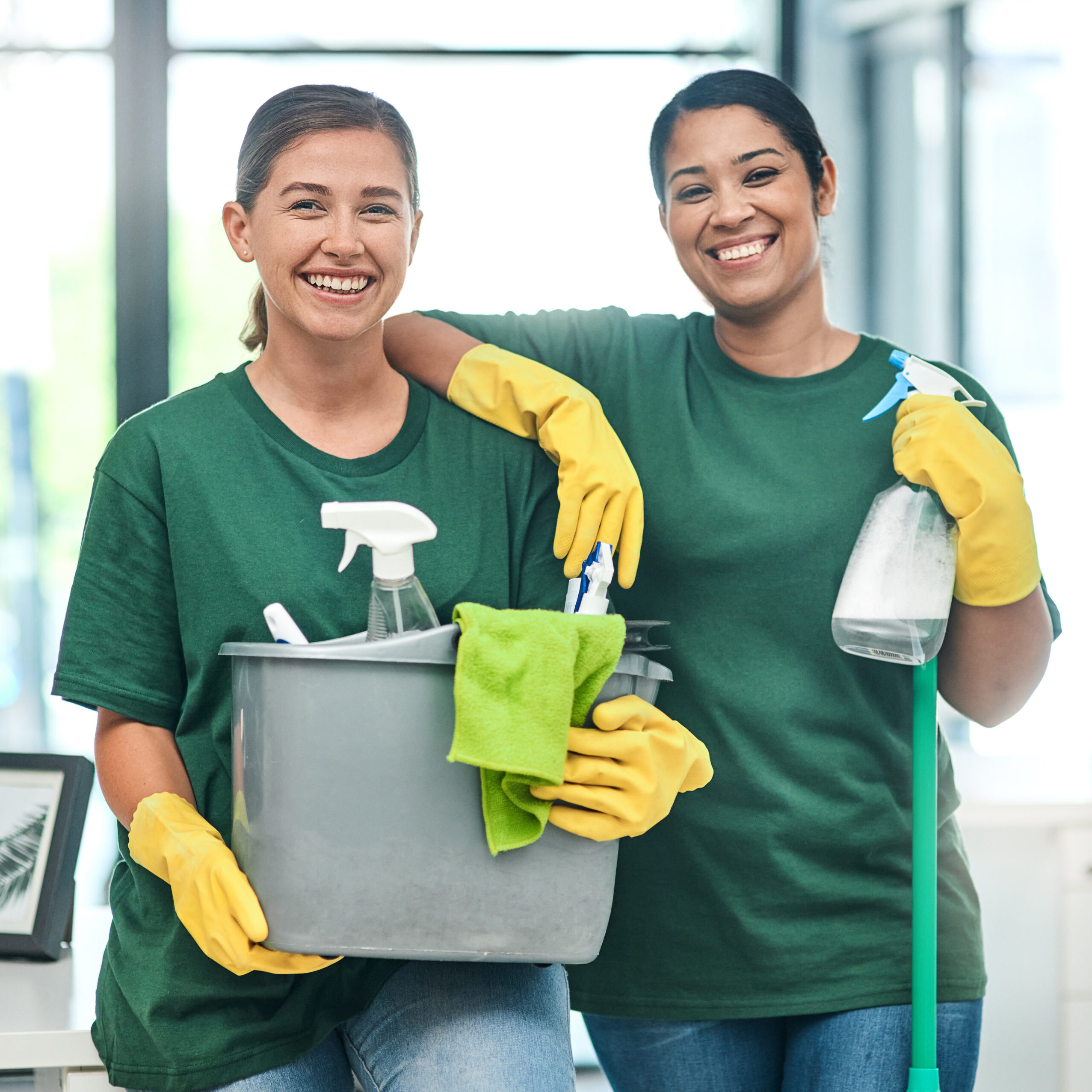 Now thats our kinda clean. Portrait of two young woman cleaning a modern office